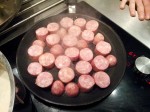Saucisses de Toulouse en cuisson